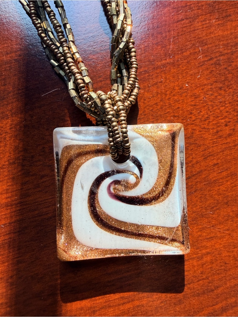 Gold and White Swirl Glass Pendant Necklace
